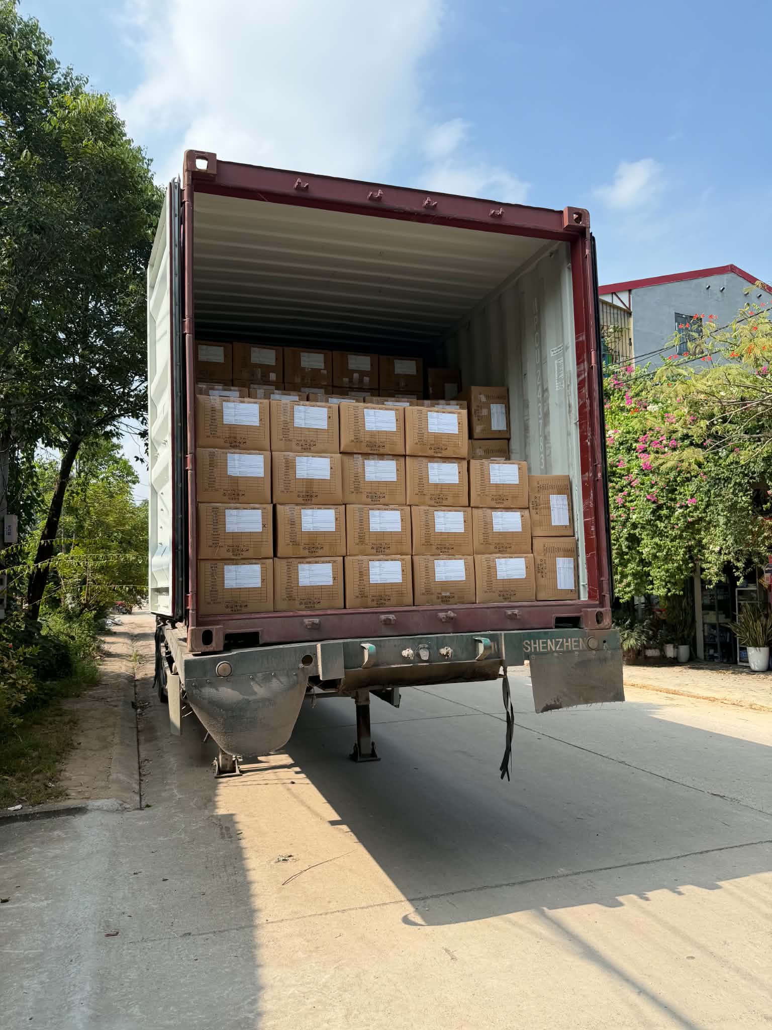 Cartons of finished towels being loaded into an export container at Son Ha Textile